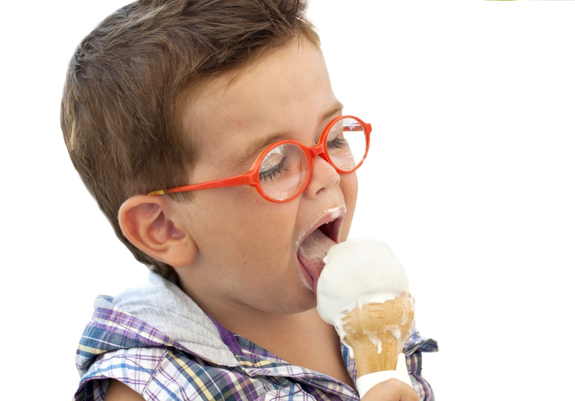 Child wearing red glasses licking an icecream